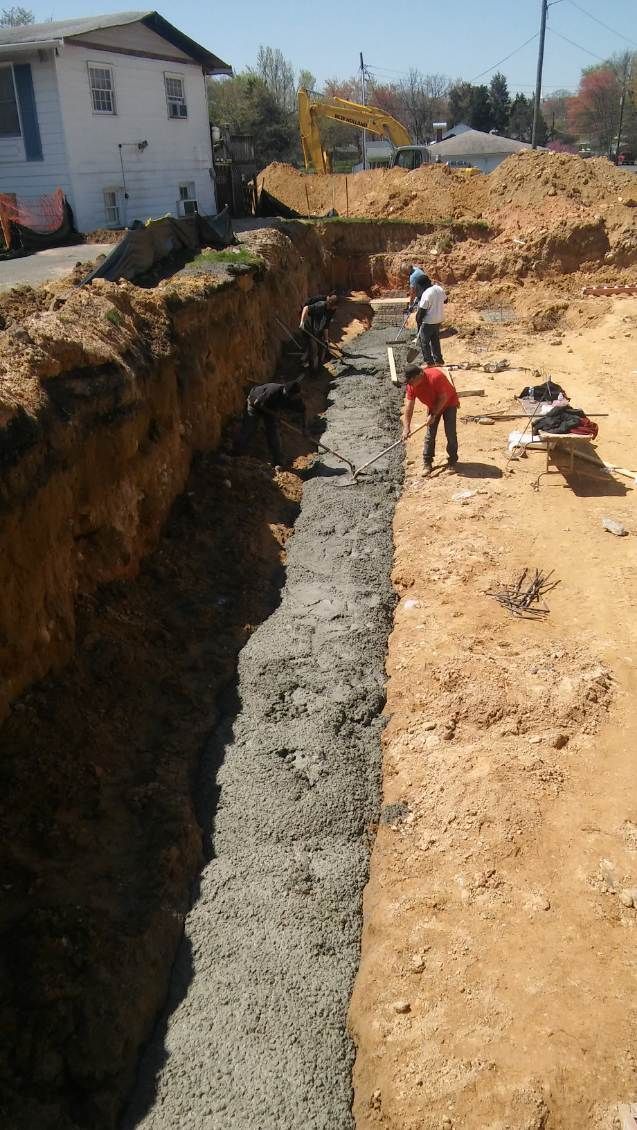 A group of construction workers are working on a construction site.