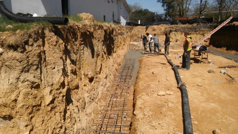 A group of construction workers are working on a construction site