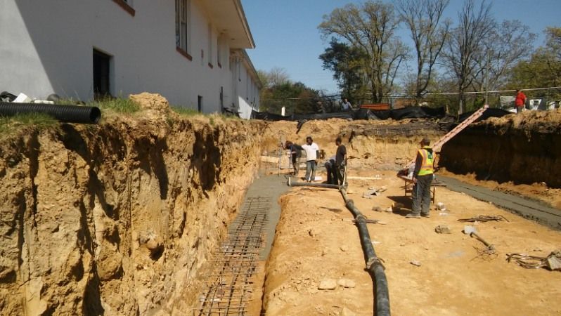 A group of construction workers are working on a construction site