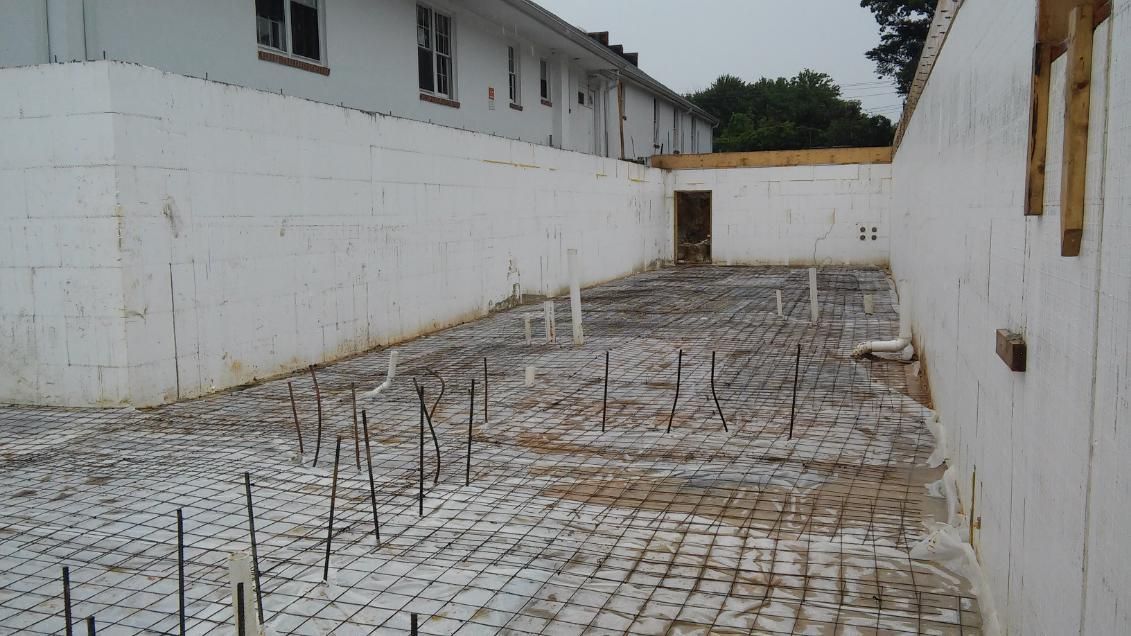 A building under construction with a lot of concrete in it