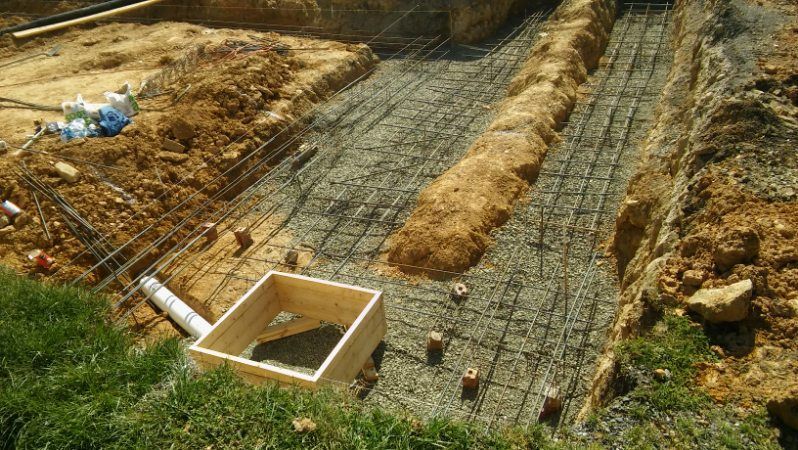 A construction site with a wooden box in the middle of it.