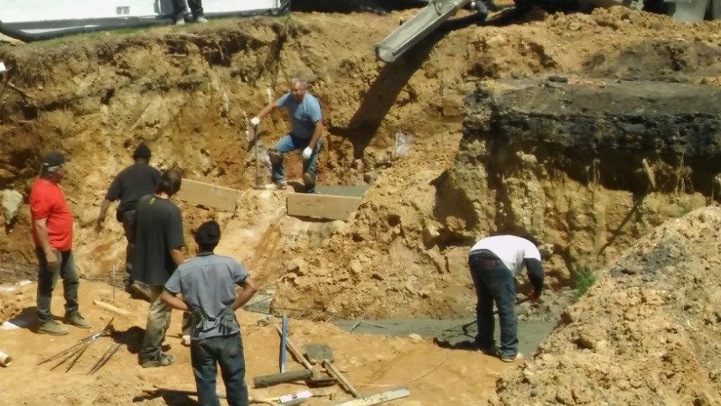 A group of men are working on a construction site.