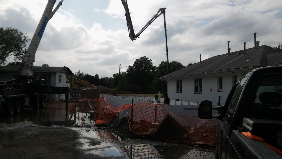 A truck is parked in front of a construction site