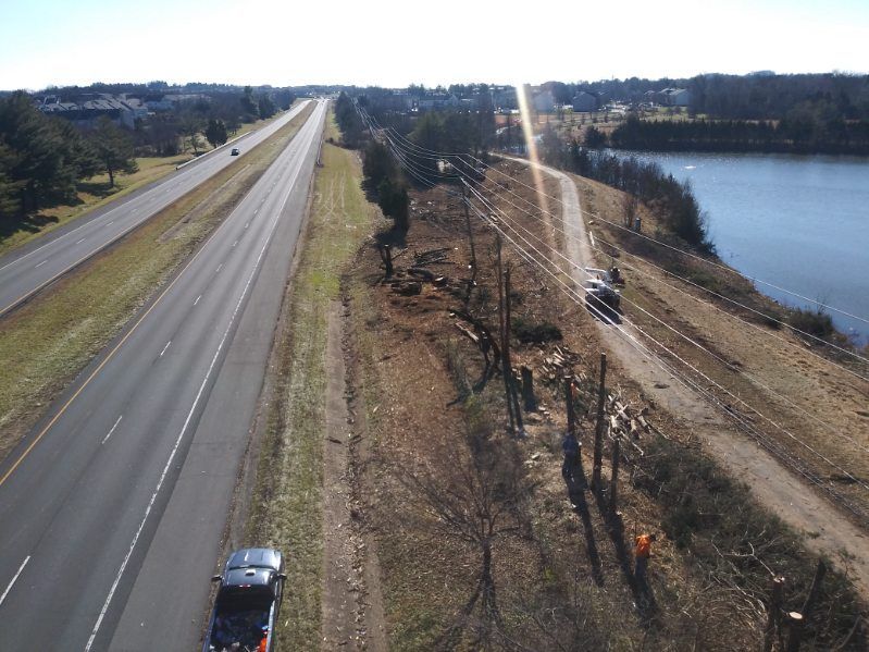 An aerial view of a highway and a lake