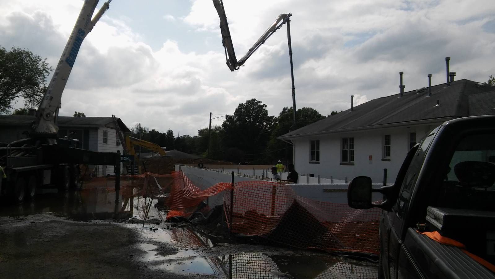 A truck is parked in front of a construction site