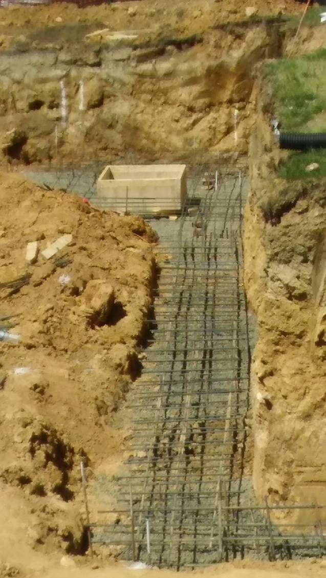 A construction site with a lot of dirt and concrete.