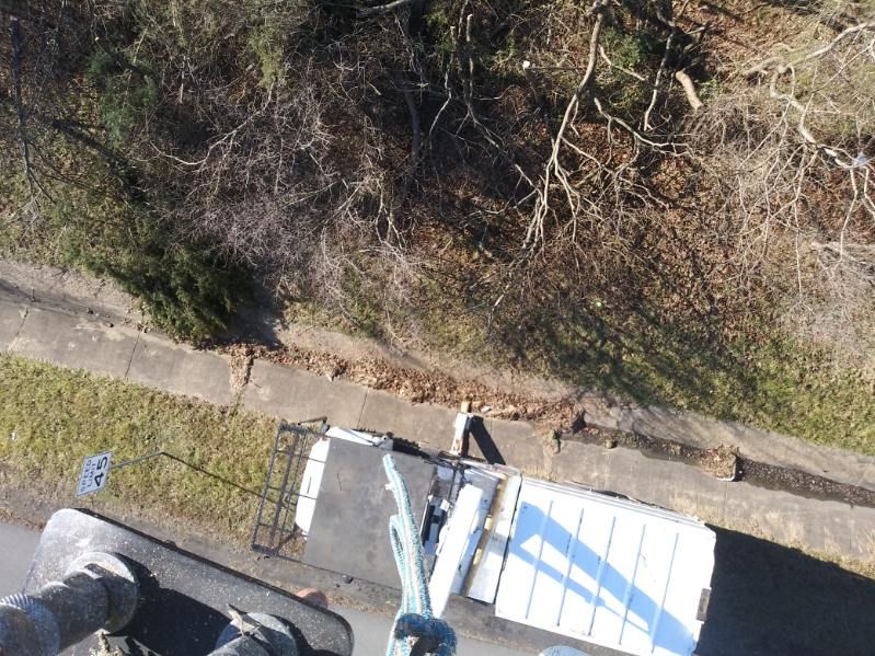 An aerial view of a person standing on top of a truck.