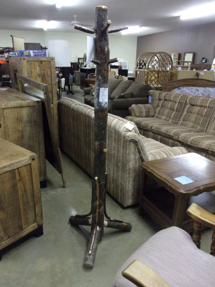 Rustic wooden coat rack in a furniture store.