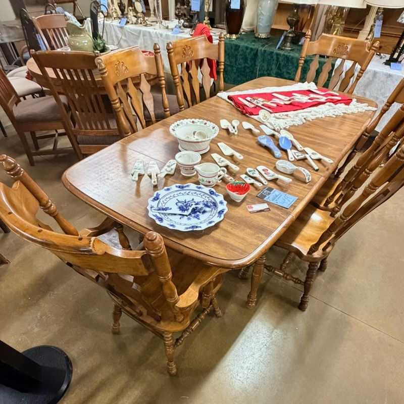Rustic wooden table and chairs with matching hutch.