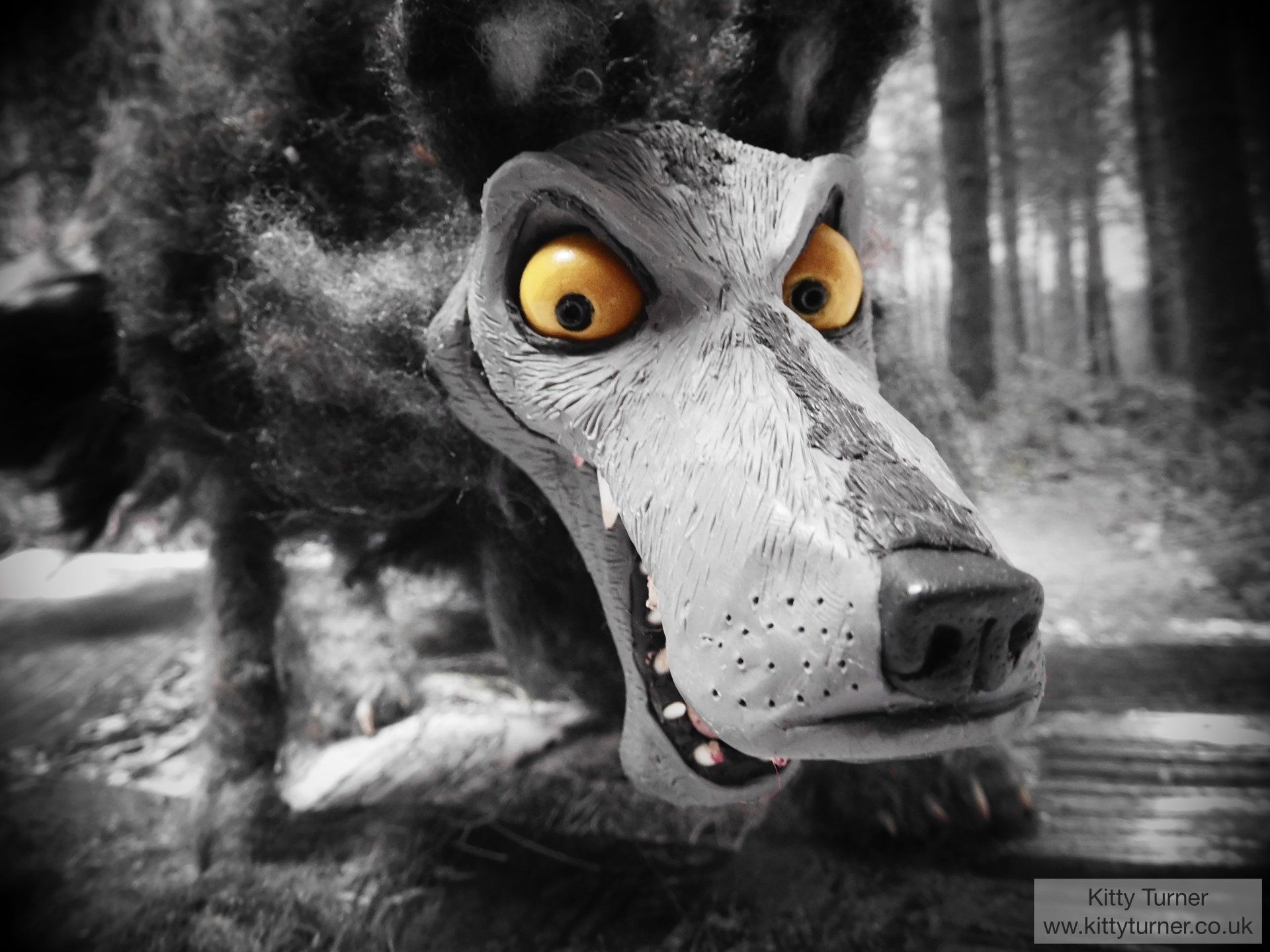 A menacing wolf 3D model stop motion puppet with yellow eyes. 