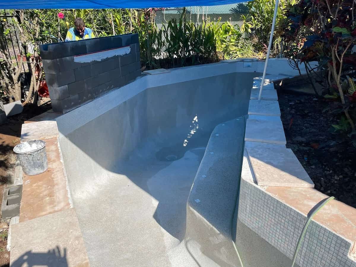 A Partially Constructed Swimming Pool With Grey Walls — Rod Hardy Plunge Pools in Girraween, NT