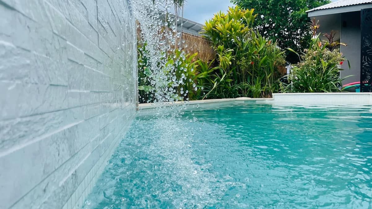 Waterfall Cascading Into a Turquoise Swimming Pool — Rod Hardy Plunge Pools in Girraween, NT