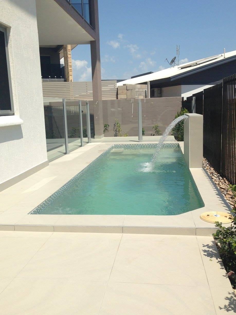 Small Turquoise Pool With a Waterfall Feature, Next to a Modern Building — Rod Hardy Plunge Pools in Girraween, NT