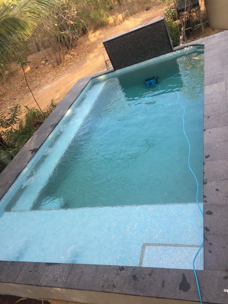 Swimming Pool With Grey Stone Border and Steps, Light Blue Water — Rod Hardy Plunge Pools in Girraween, NT