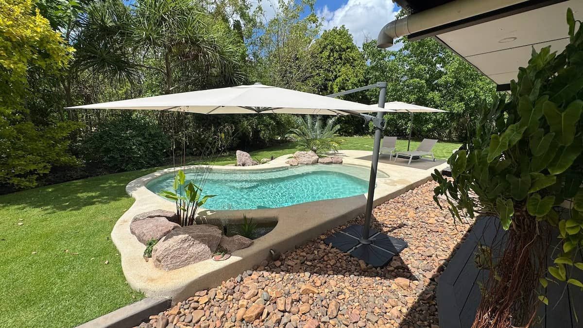 Small Pool With Two White Umbrellas in a Backyard — Rod Hardy Plunge Pools in Howard Springs, NT