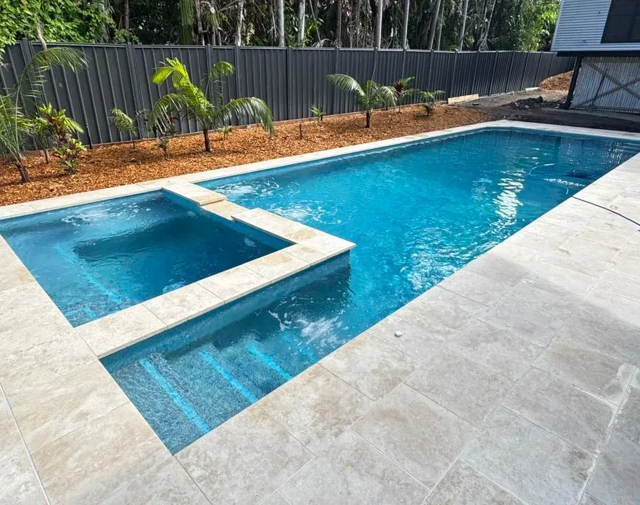 Small Backyard Pool With Spa and Beige Pavers— Rod Hardy Plunge Pools in Girraween, NT