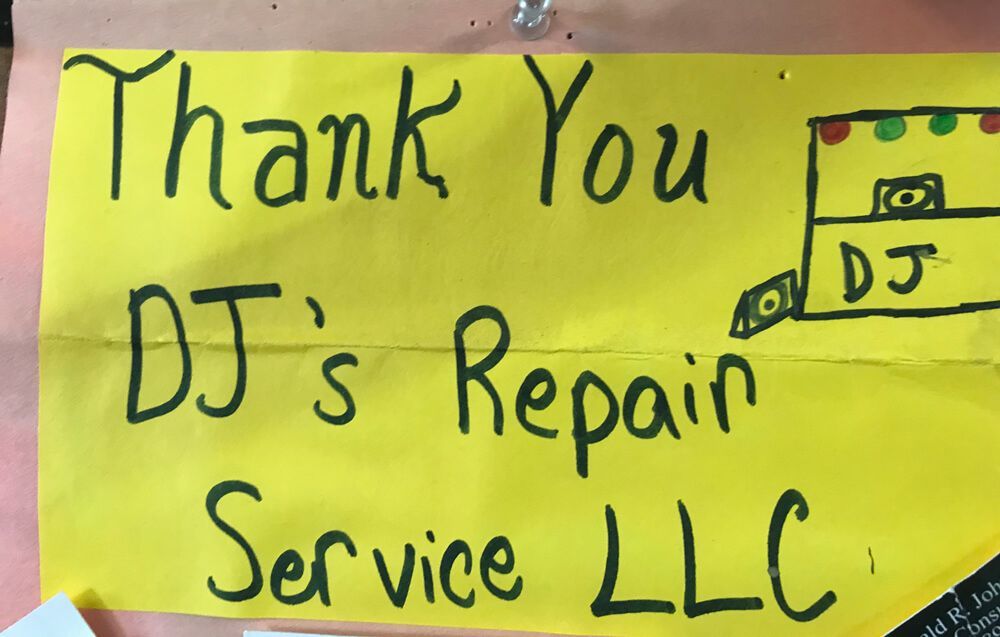 A yellow sign that says thank you dj 's repair service llc