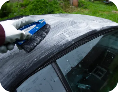 Red Bentley convertible parked on gravel. Black top and wheels.