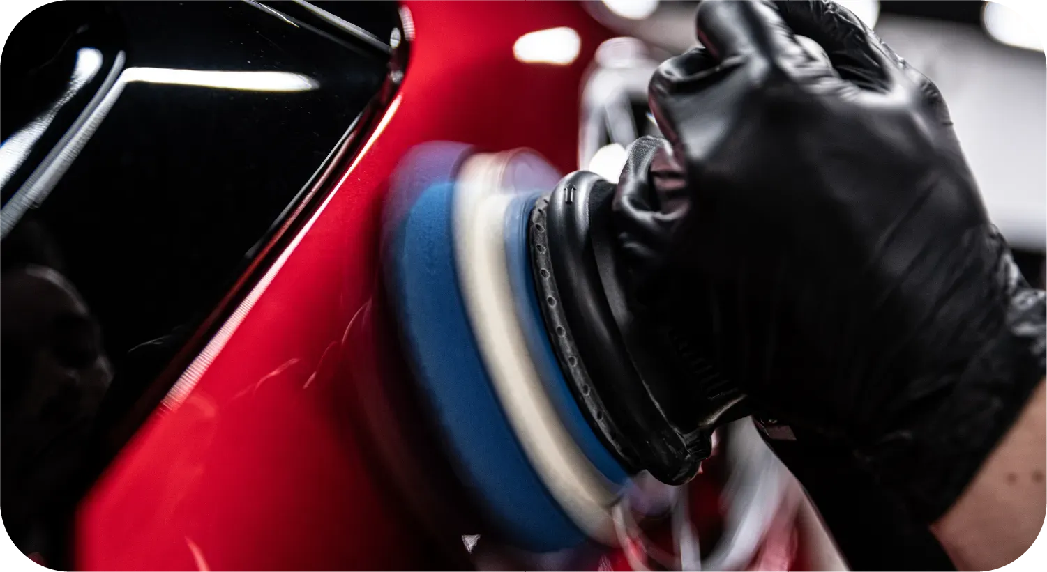 Blue car rear with SQ2 emblem; red square, black letters.