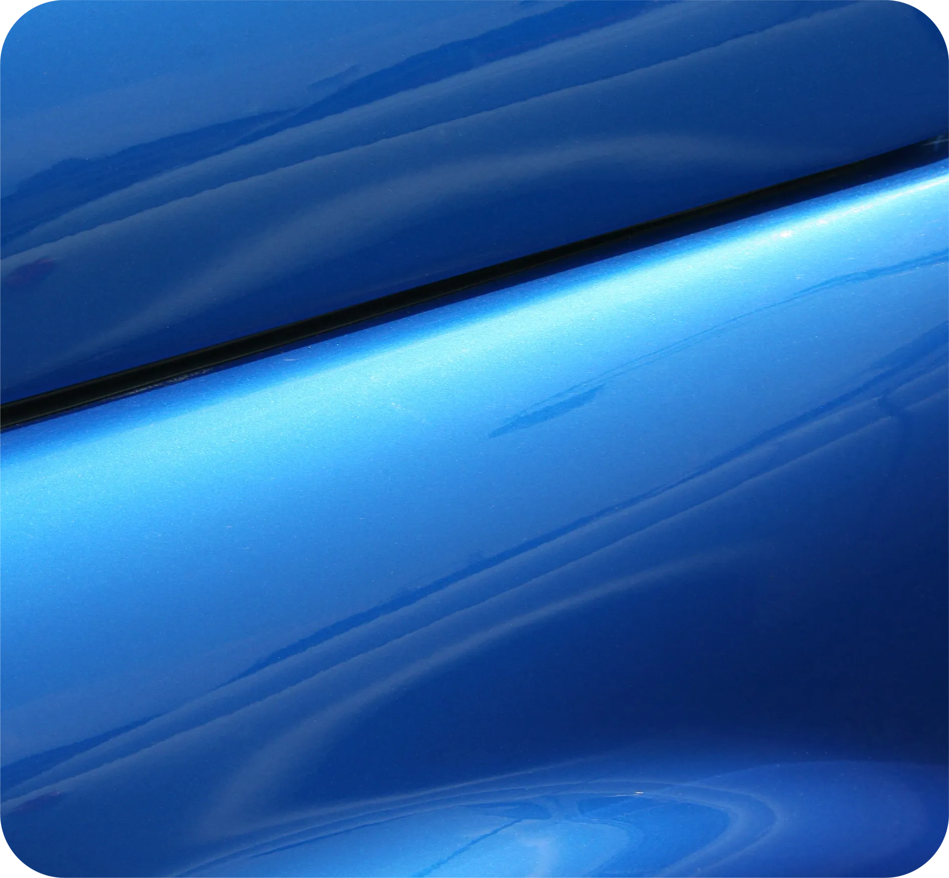 Close-up of a blue car's rear with a black and red 