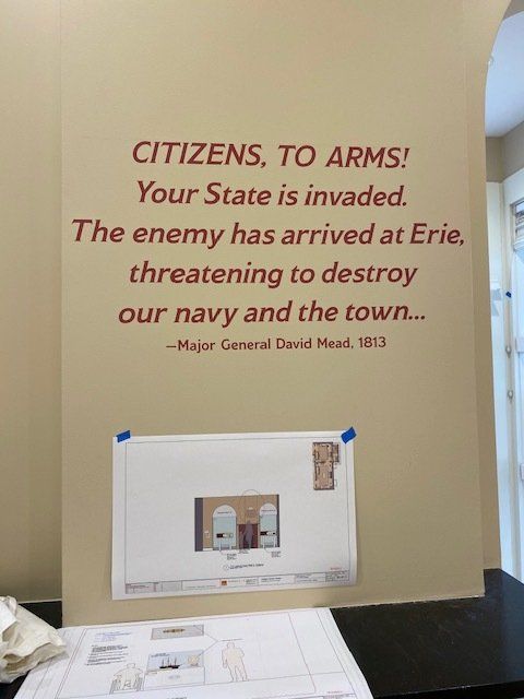 A sign on a wall that says citizens to arms your state is invaded