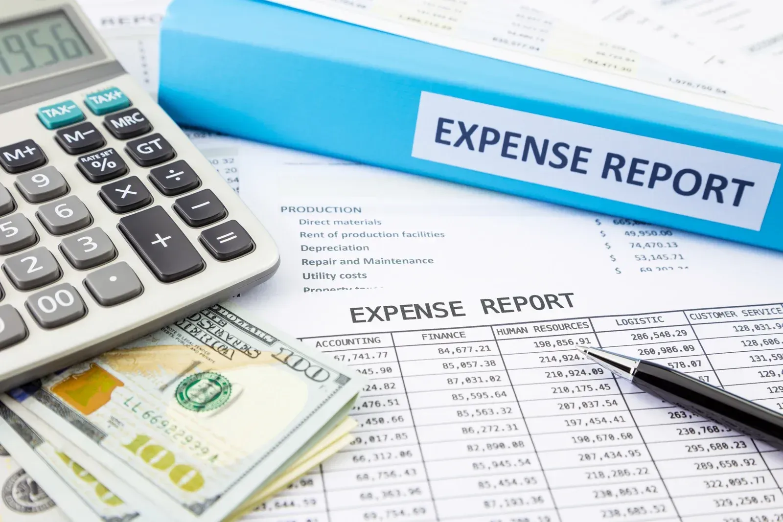 Expense report documents with calculator, cash, and pen on a desk
