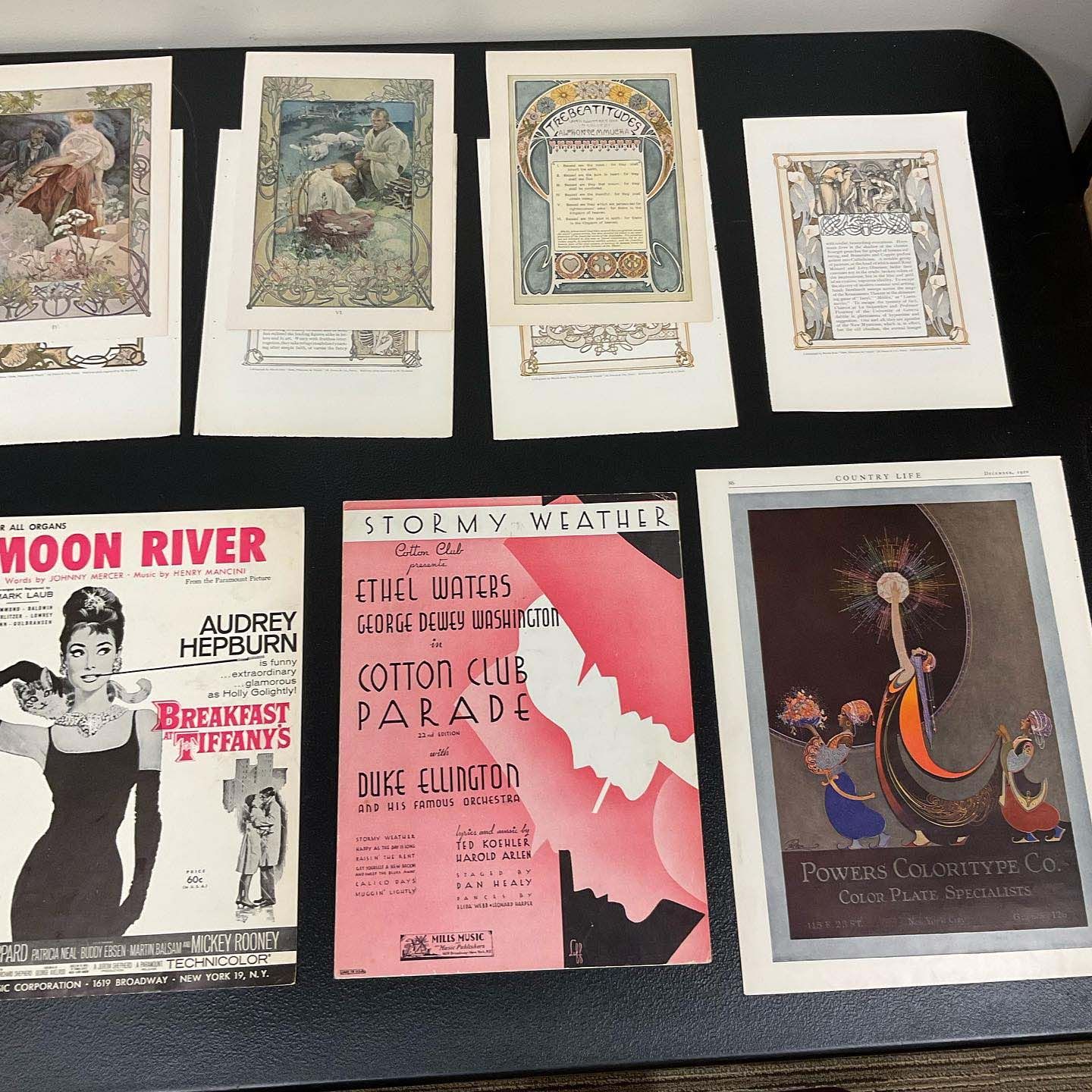 A collection of posters including moon river and breakfast at tiffany's