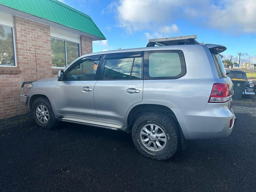 White Car for Servicing — John Zelukovic Smash Repairs in Orange, NSW
