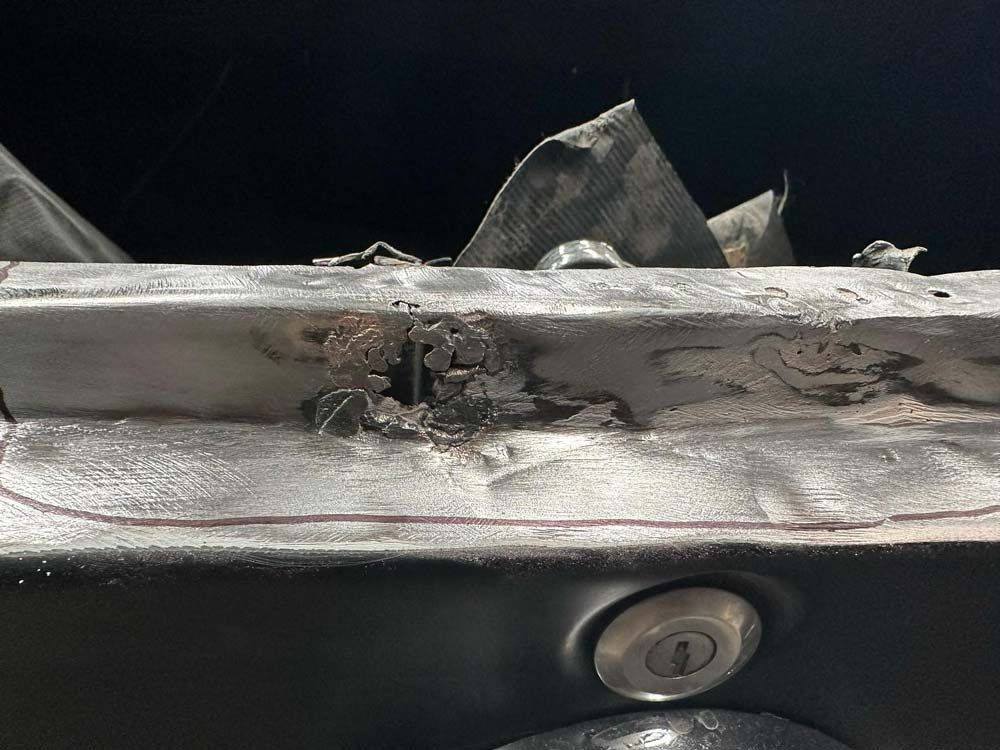 Car Metal with Hole — John Zelukovic Smash Repairs in Mudgee, NSW