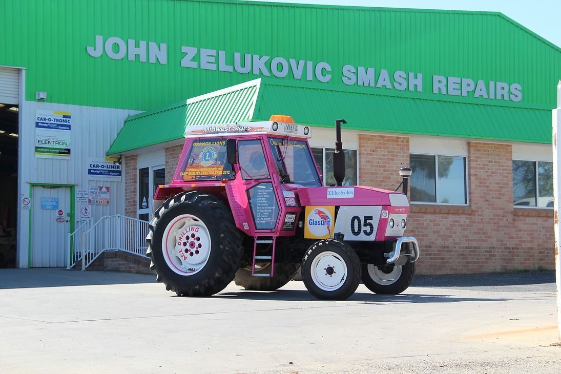 Camp Quality Tractor Repaired and Repainted — John Zelukovic Smash Repairs in Orange, NSW
