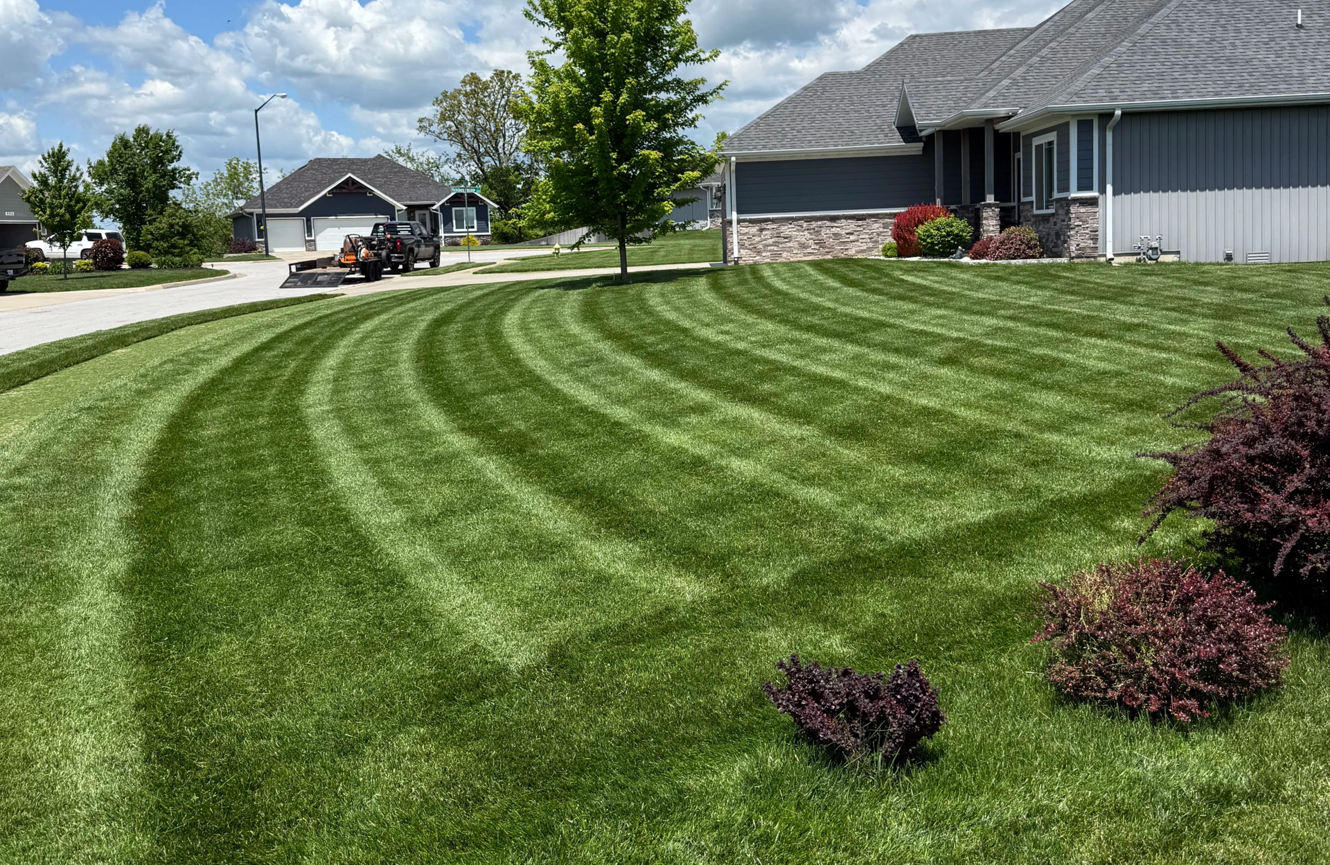 Green lawn mowed by best lawn care company in Springfield MO