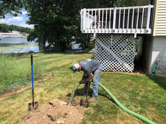 Man Cleaning Septic Tank — Baldwinsville, NY — Aces-Four Septic Service