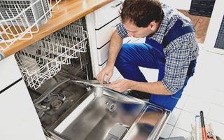 Technician Working with Oven - Repairs in Seminole, FL