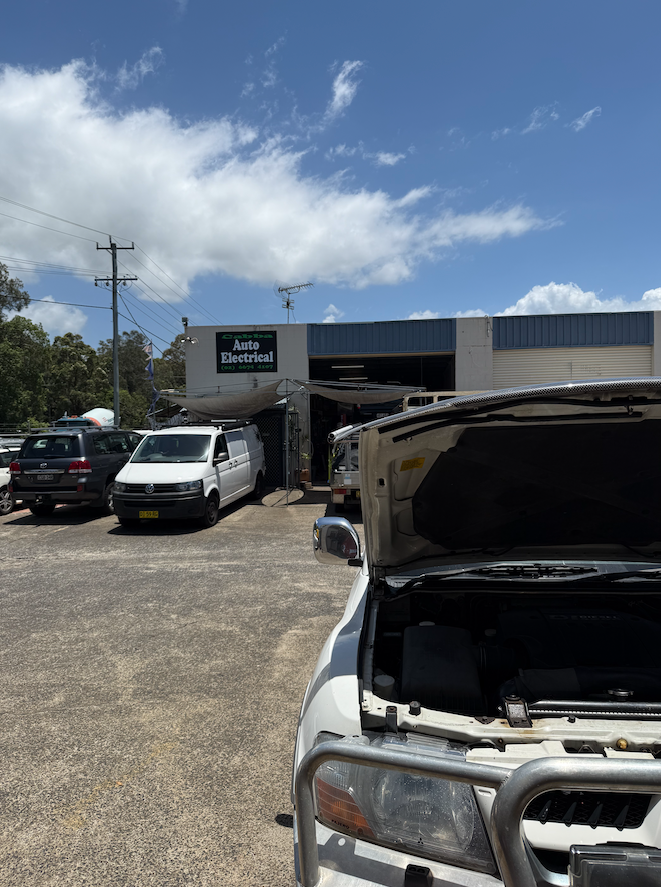 A Car With The Bonet Up Im Front Of A Store With A Sign That Says Auto Electrical — Cabba Auto Electrics In Chinderah, NSW