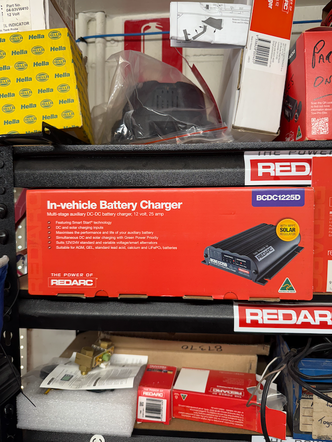 An In-vehicle Battery Charger Sitting On A Shelf— Cabba Auto Electrics In Chinderah, NSW