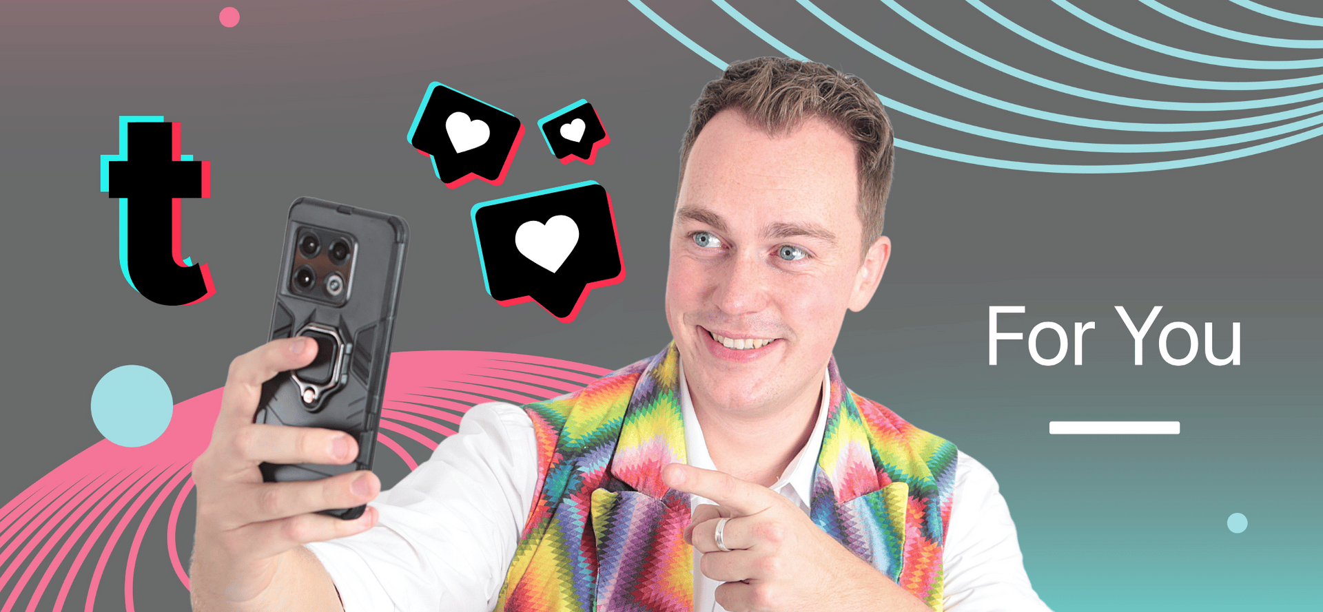 A man in a rainbow vest is taking a selfie with his cell phone.