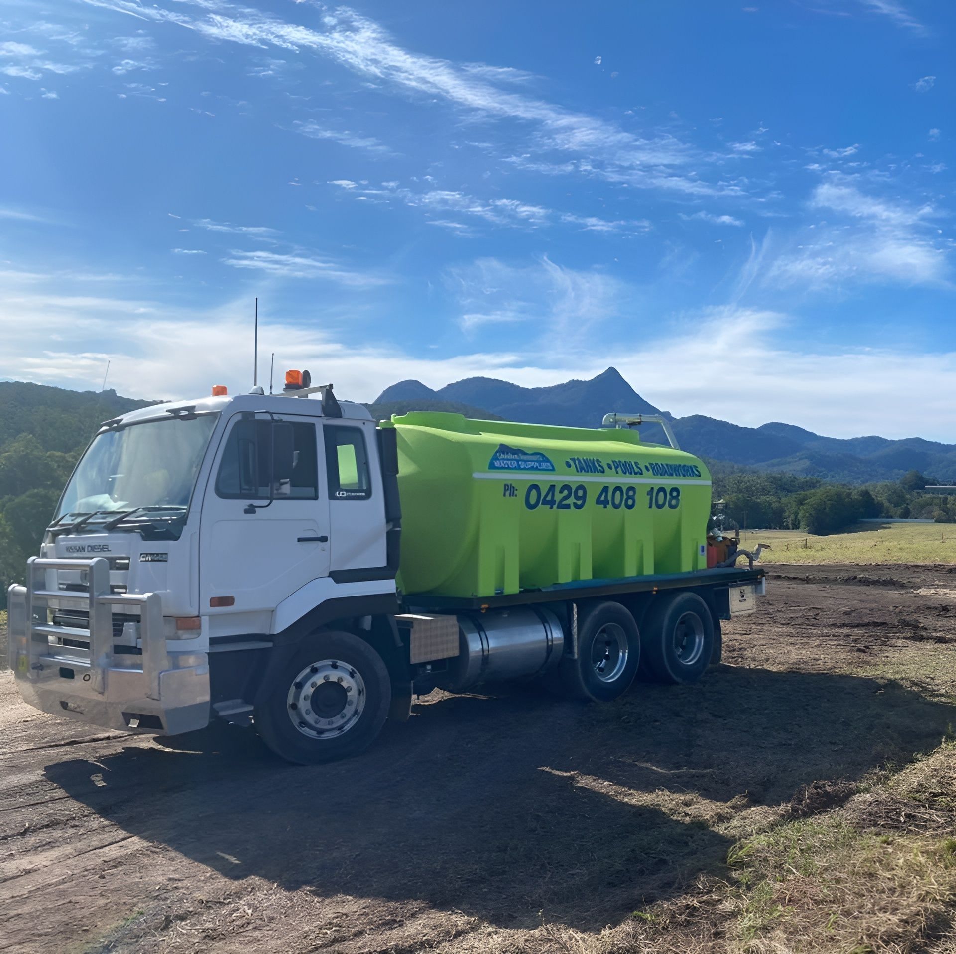 A Truck is Driving Down a Road — Jaiden Tanners Water Supplies in Northern Rivers, NSW