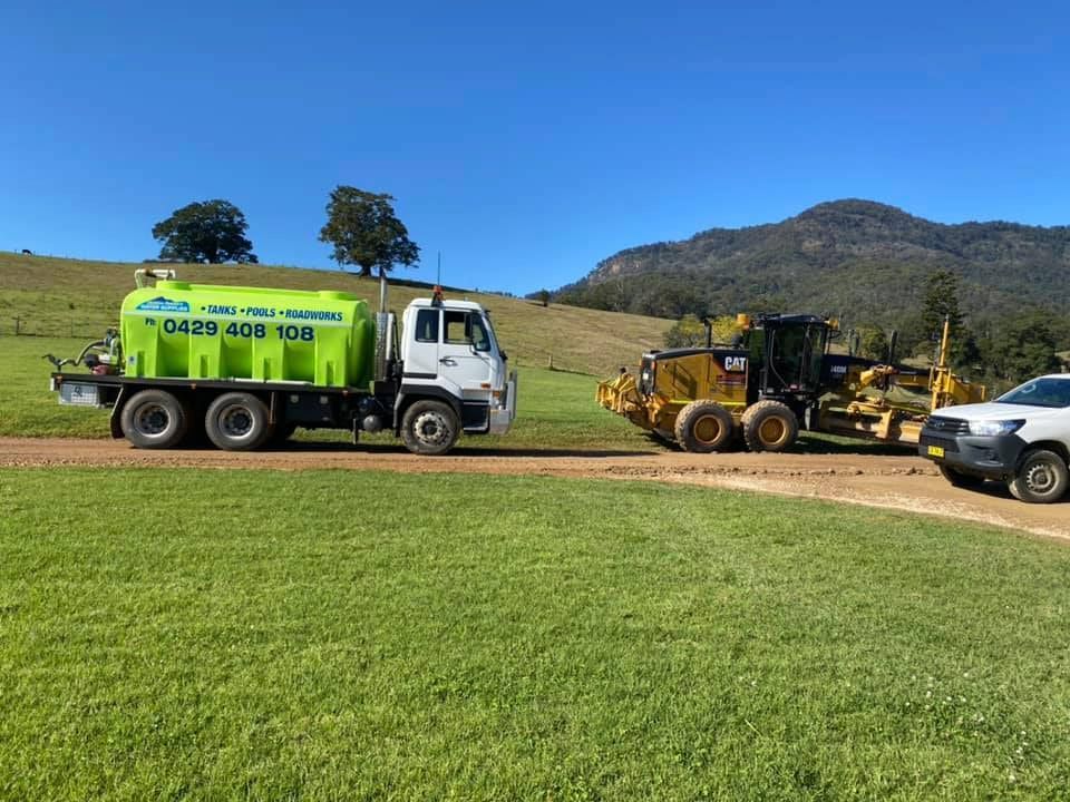 An Orange Vacuum Truck is Parking on the Road — Jaiden Tanners Water Supplies in Northern Rivers, NSW
