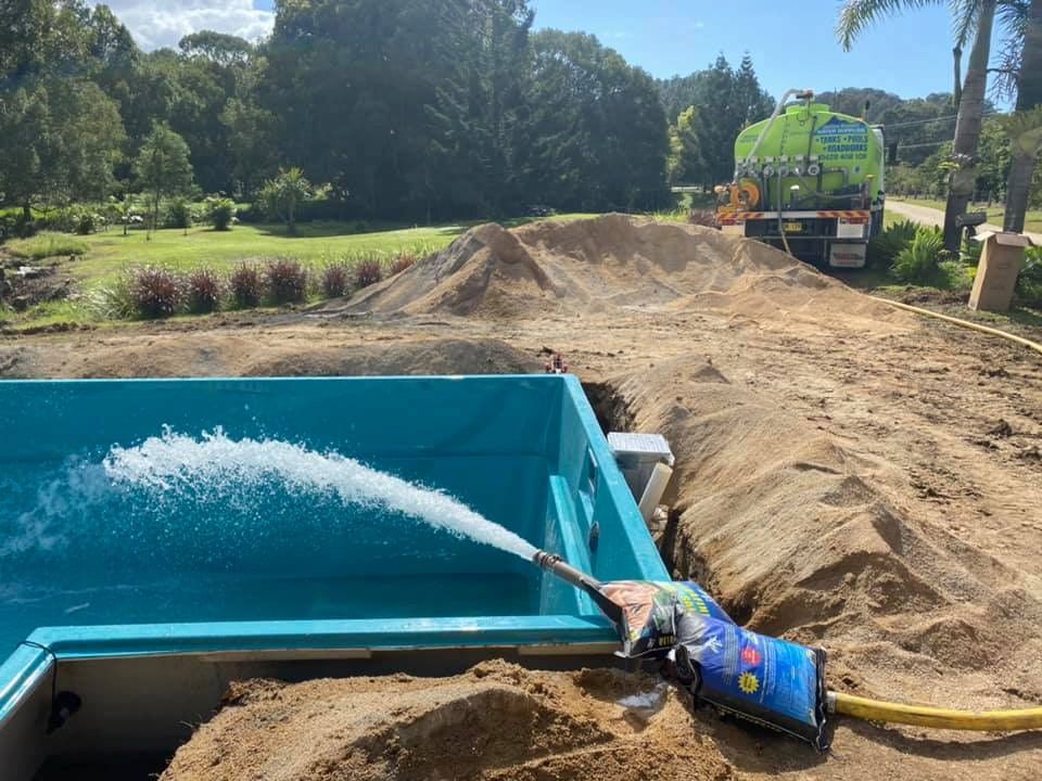 A Hose is Being Used to Pump Water Into a Pool — Jaiden Tanners Water Supplies in Murwillumbah, NSW