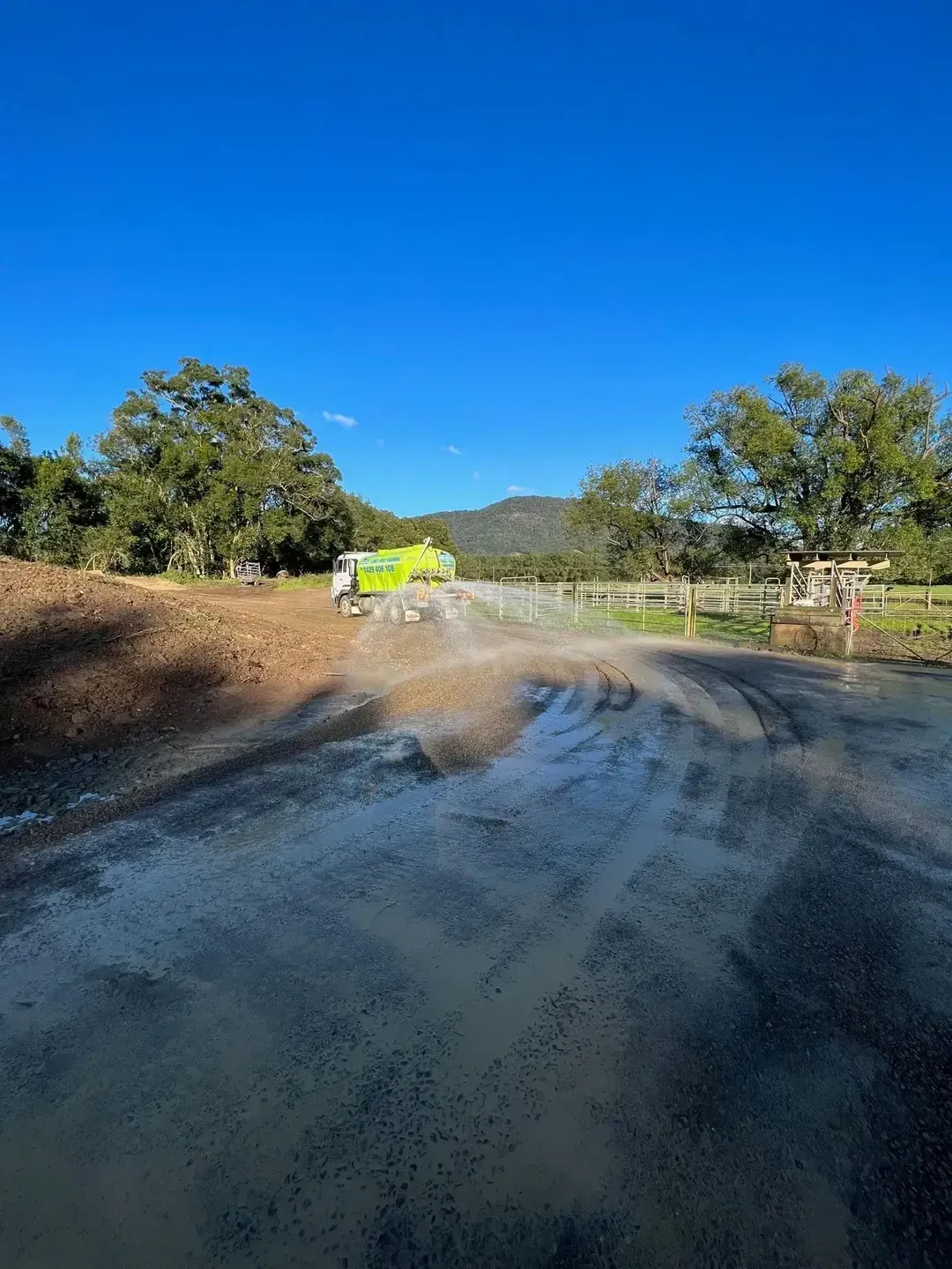 A green and white truck is parked in a parking lot. — Jaiden Tanners Water Supplies in Burringbar, NSW