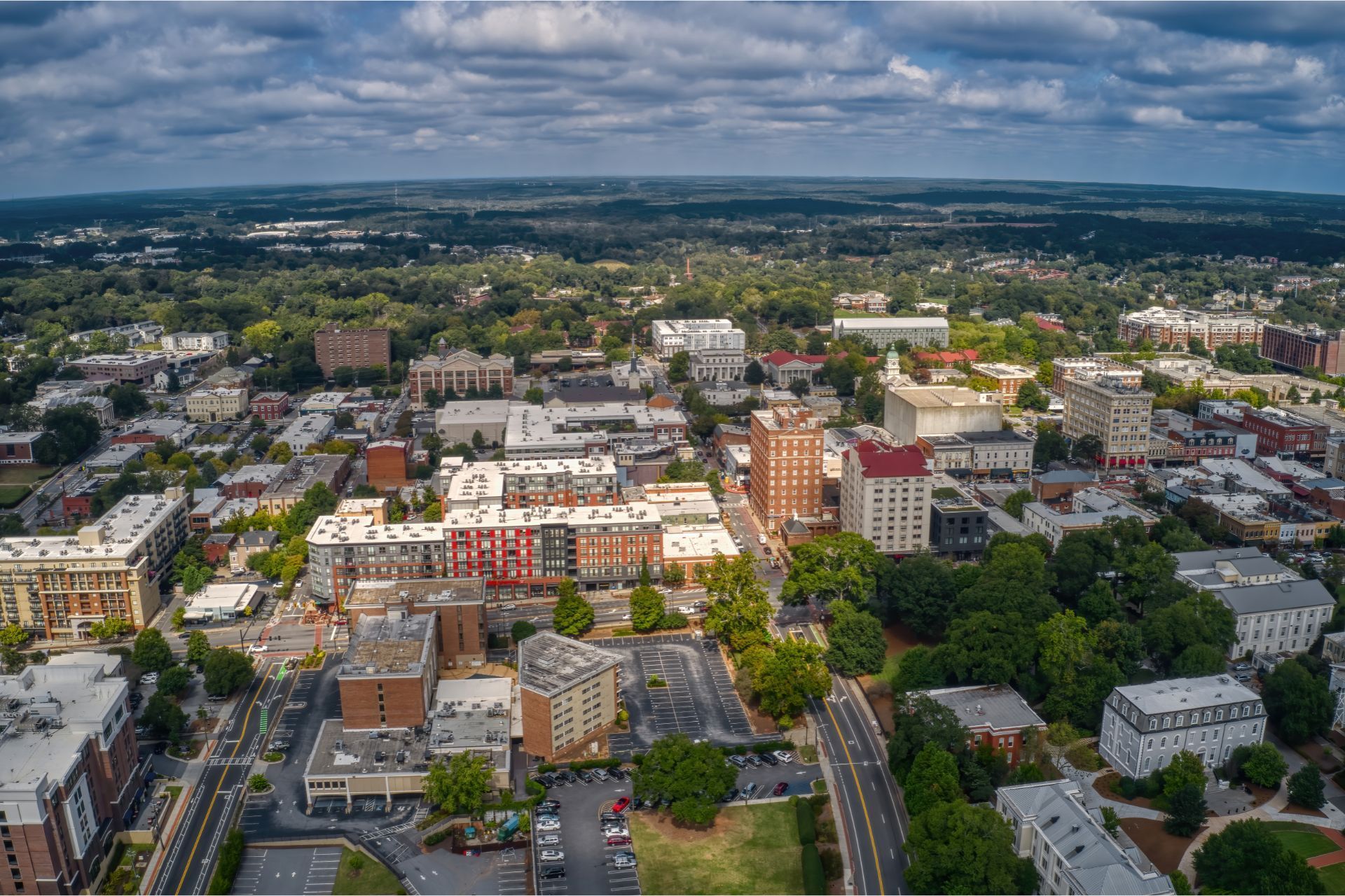 Overhead view of Athens, GA with buildings and greenery.