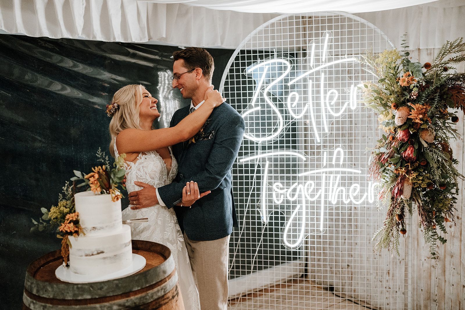 Newlyweds embrace in front of 