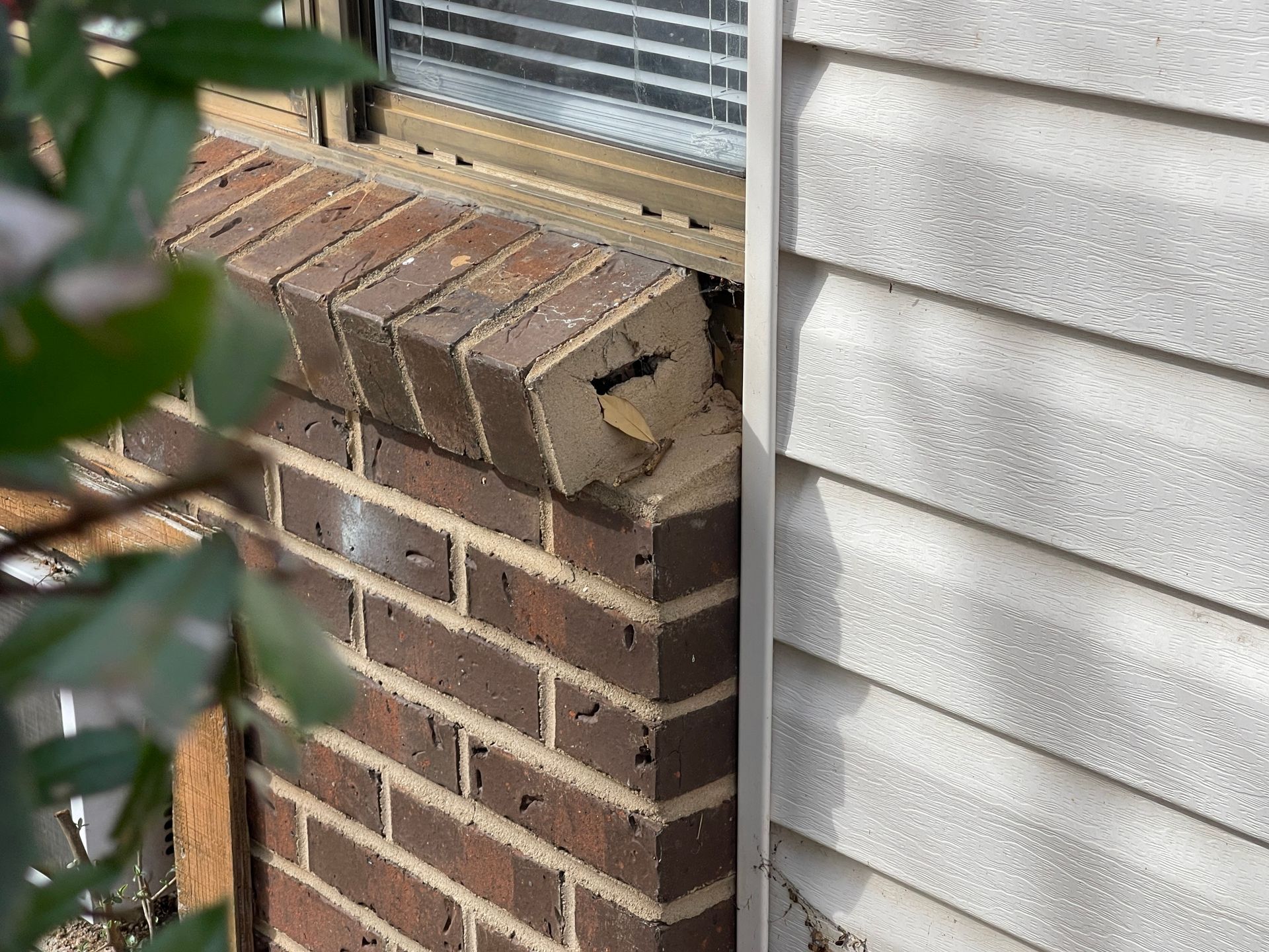There are a lot of air conditioners on the roof of a building.