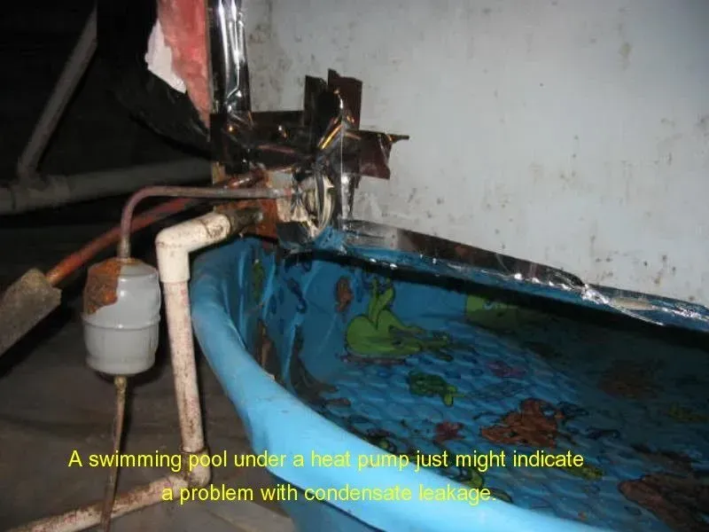 A swimming pool under a heat pump that might indicate a problem with condensation
