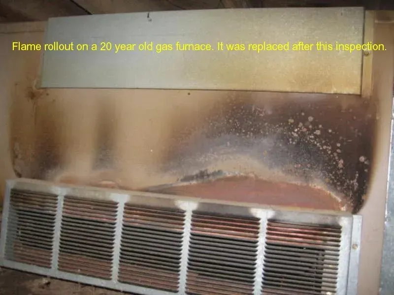 A picture of a flame rollout on a 20 year old gas furnace