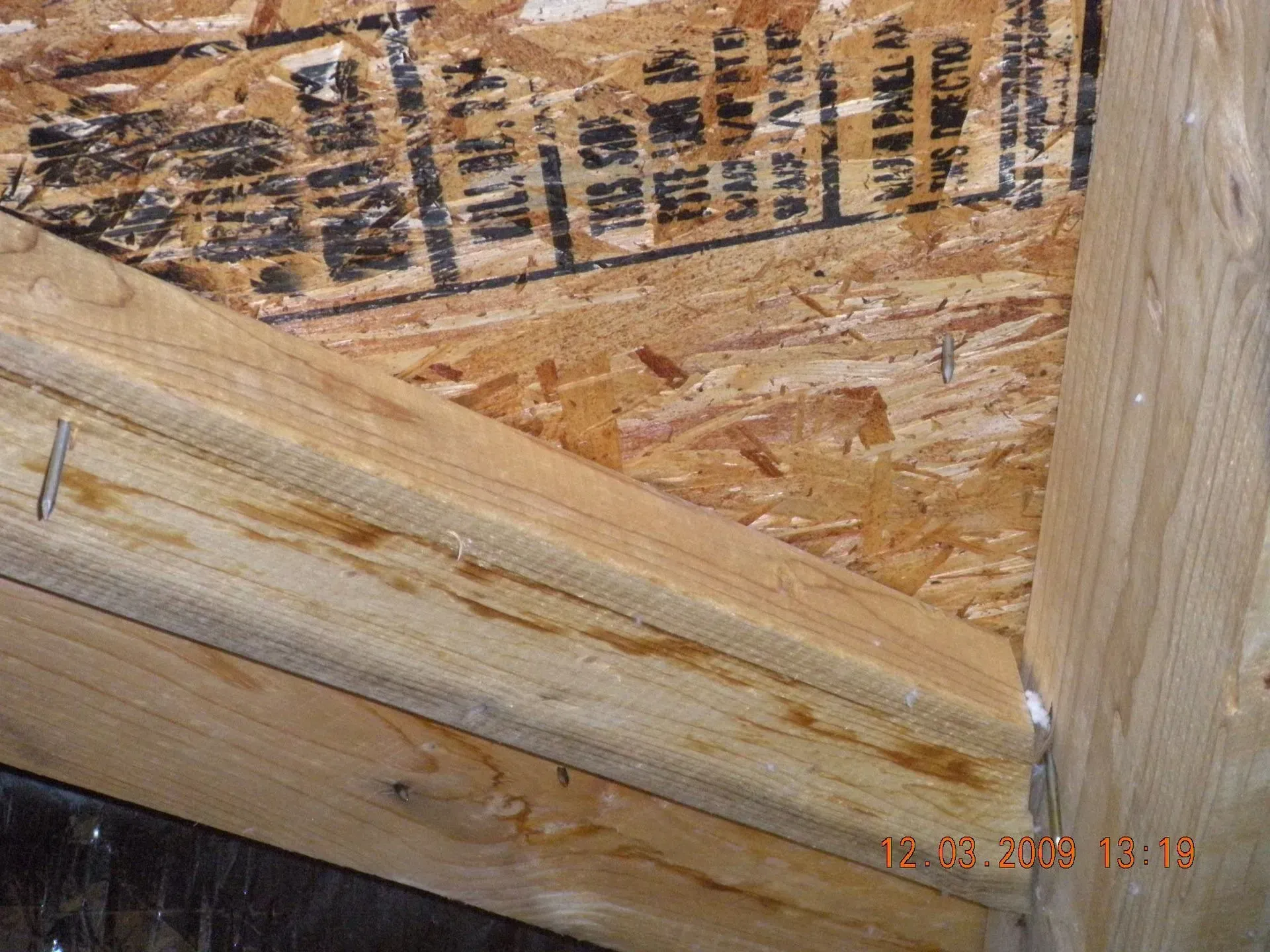 A close up of a piece of wood with a label on it.