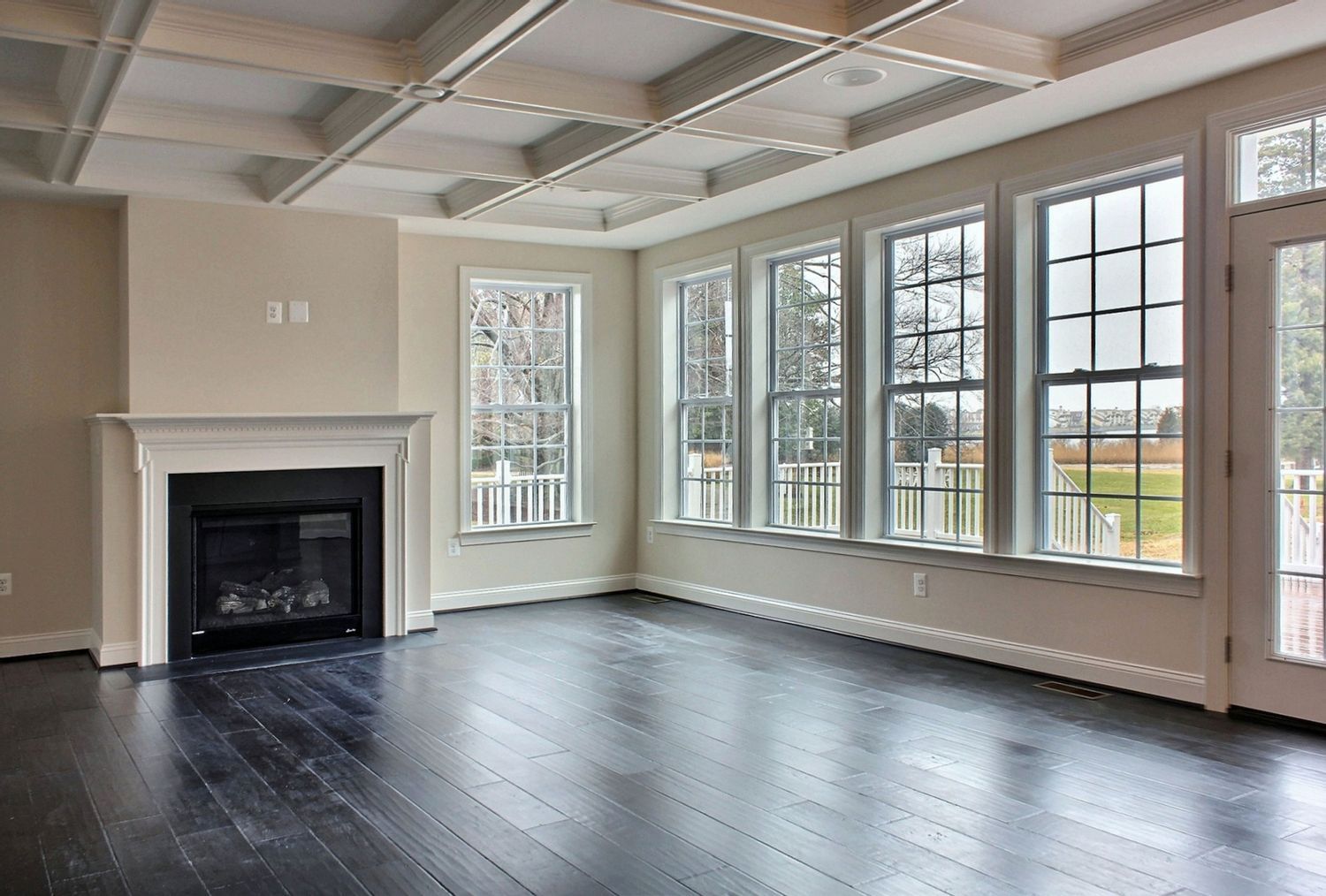 Large open living area with fireplace and numerous windows | Build on Your Lot | Covell Communities | Chester, Maryland 21619