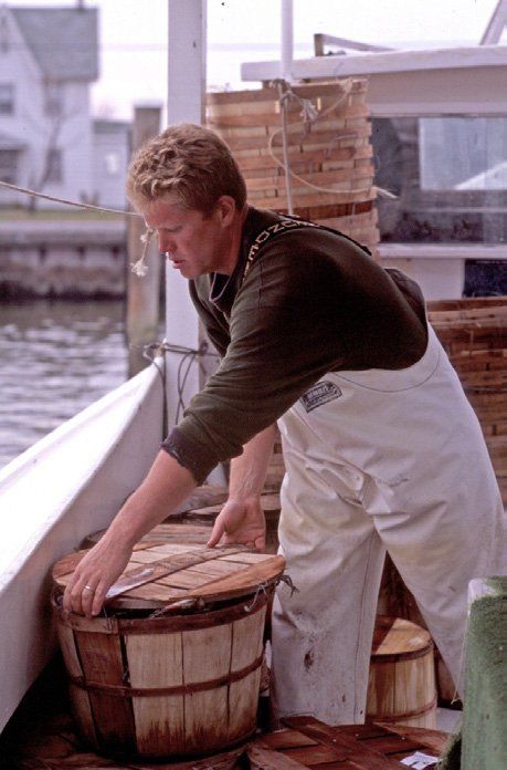 Man working in seafood market | Eastern Shore History | Covell Communities | Chester, Maryland 21619