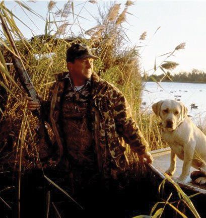 Man waterfowl hunting with dog | Eastern Shore Natural Beauty | Covell Communities | Chester, Maryland 21619