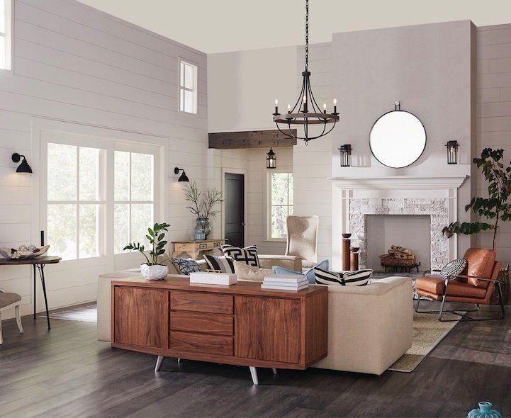 A living room filled with furniture and a fireplace